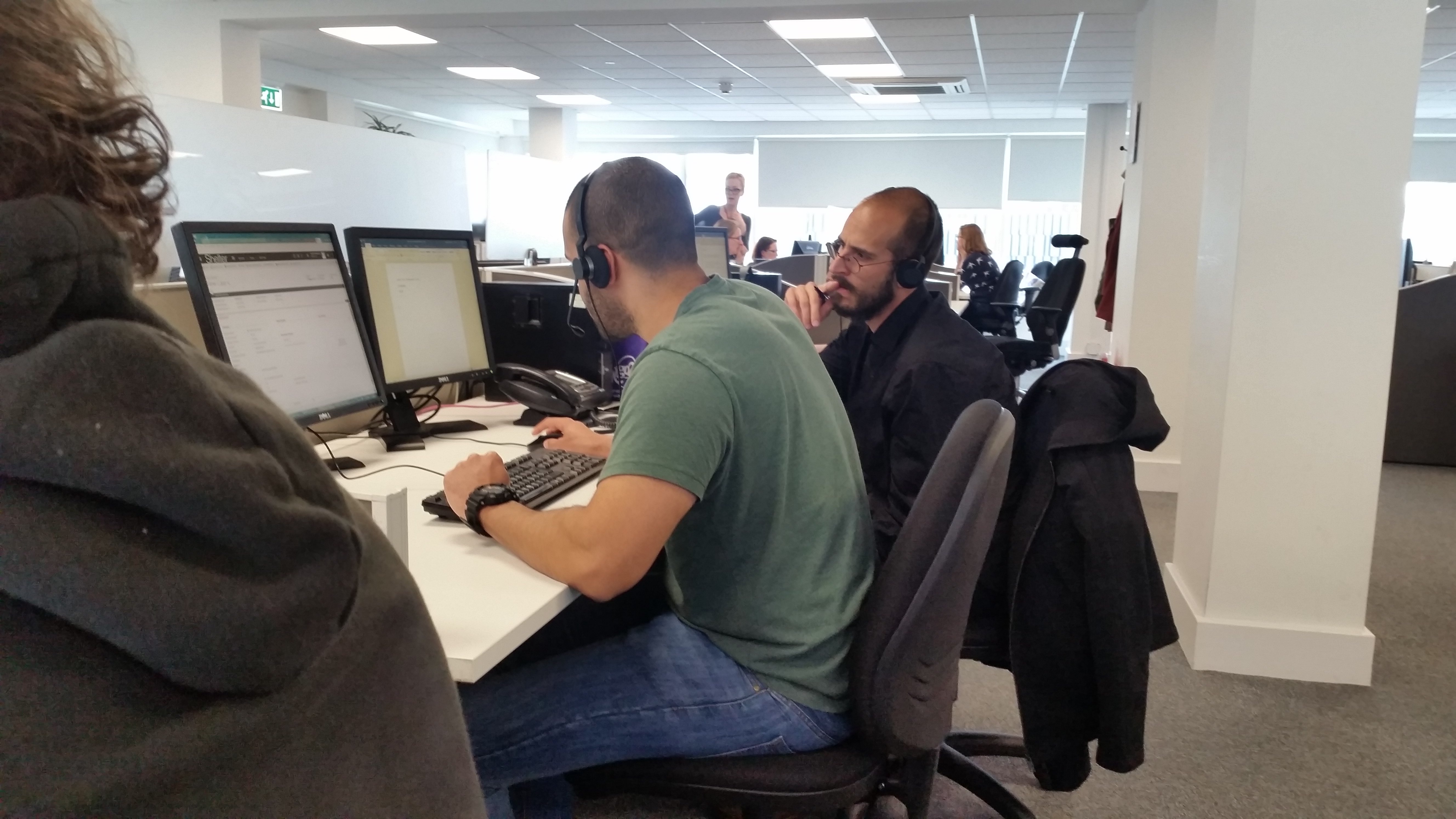 Eric shadowing a Helpline advisor and taking notes.